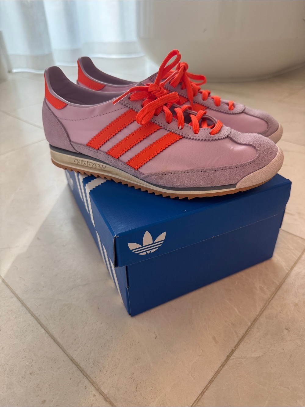 adidas Womenβs Lilac Sneakers with Neon Orange Stripes